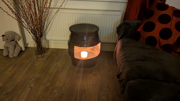 upcycled Beer barrel coffee table with a candle in