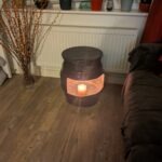upcycled Beer barrel coffee table with a candle in