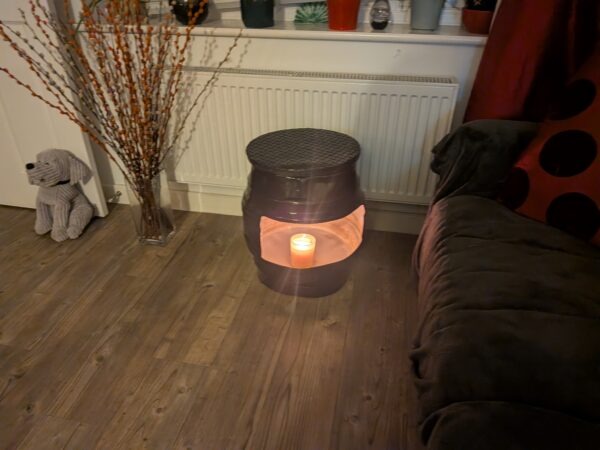 upcycled Beer barrel coffee table with a candle in