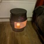 upcycled Beer barrel coffee table with a candle in