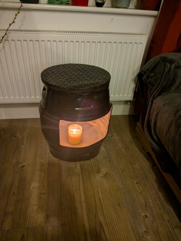 upcycled Beer barrel coffee table with a candle in