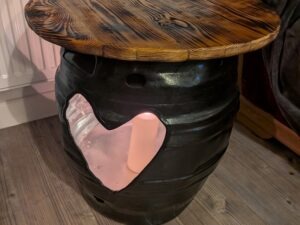 Upcycled beer barrel heart table with burnt pallet wood top