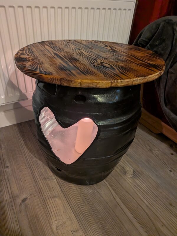 Upcycled beer barrel heart table with burnt pallet wood top
