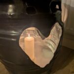 Black beer barrel table with three plasma-cut heart openings