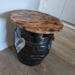 Burnt reclaimed pallet wood top on handmade beer barrel table