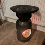 Upcycled gas cylinder coffee table with scorched timber top