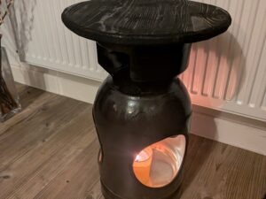 Upcycled gas cylinder coffee table with scorched timber top