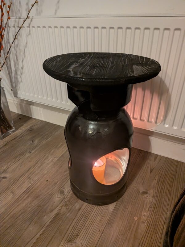 Upcycled gas cylinder coffee table with scorched timber top