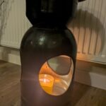 Upcycled gas cylinder coffee table with scorched timber top