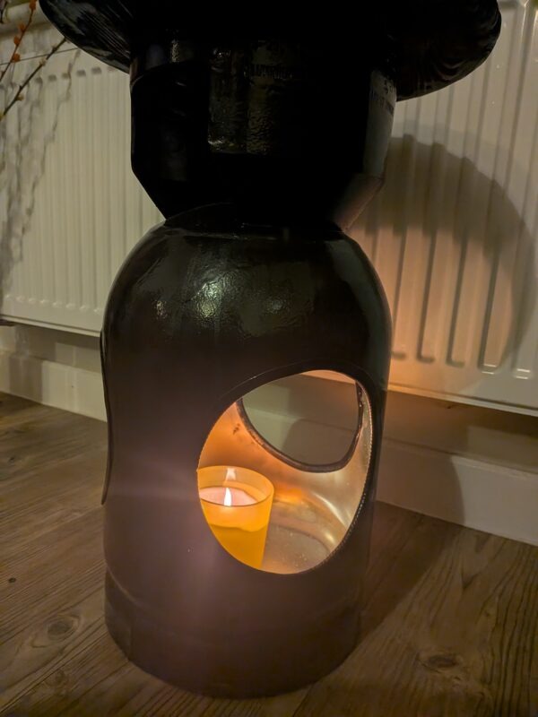 Upcycled gas cylinder coffee table with scorched timber top