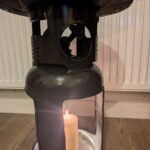 Upcycled gas cylinder coffee table with square cut-outs and scorched timber top
