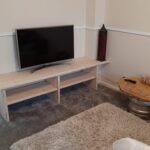 Handmade scaffold board TV unit with television and storage shelves