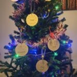 personalised christmas tree decorations hanging on a tree