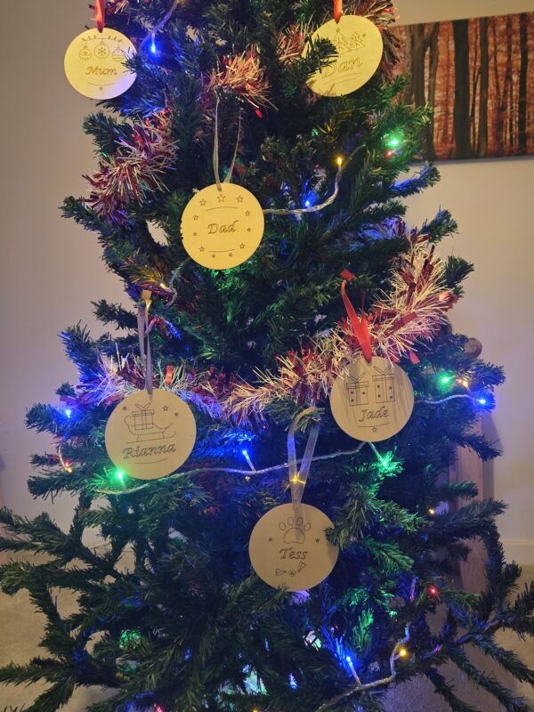 personalised christmas tree decorations hanging on a tree