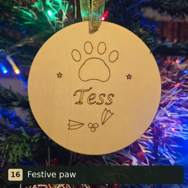 Festive paw personalised wooden Christmas tree decoration engraved with Tess